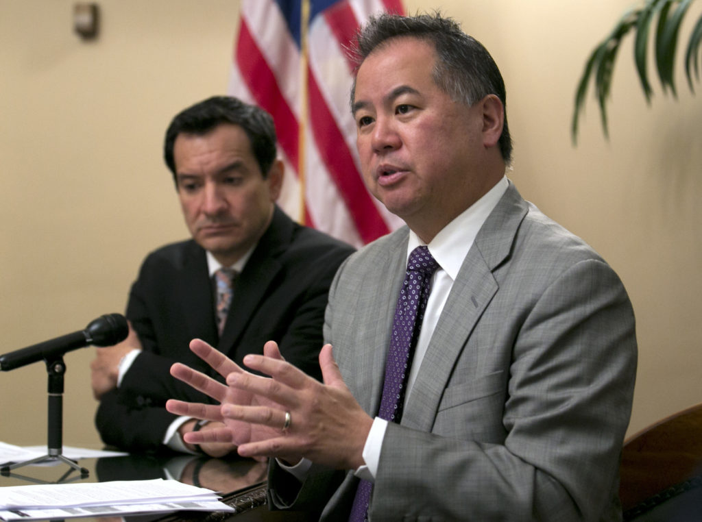 Assemblyman Phil Ting, D-San Francisco, right, chair of the Assembly budget committee discusses the state budget agreement reached between Gov. Jerry Brown and Democratic lawmakers, Tuesday, June 13, 2017, in Sacramento, Calif. Mitchell was accompanied Assembly Speaker Anthony Rendon, D-Paramount. (AP Photo/Rich Pedroncelli)